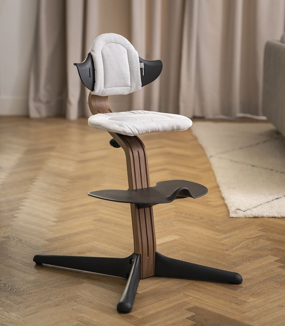 Stokke® Nomi® Chair. Walnut/Black with Nordic Grey cushion.